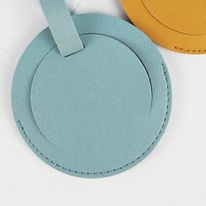 Round luggage tags