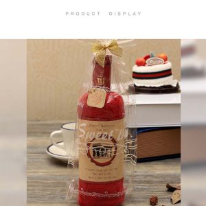 Towels in the shape of red wine bottles