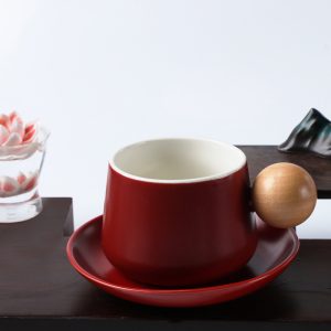 Delicate coffee mug with round handle