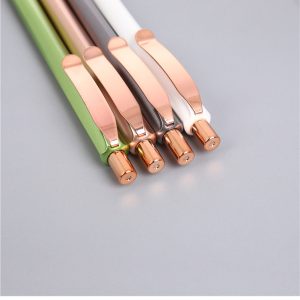 Press the rose gold ballpoint pen